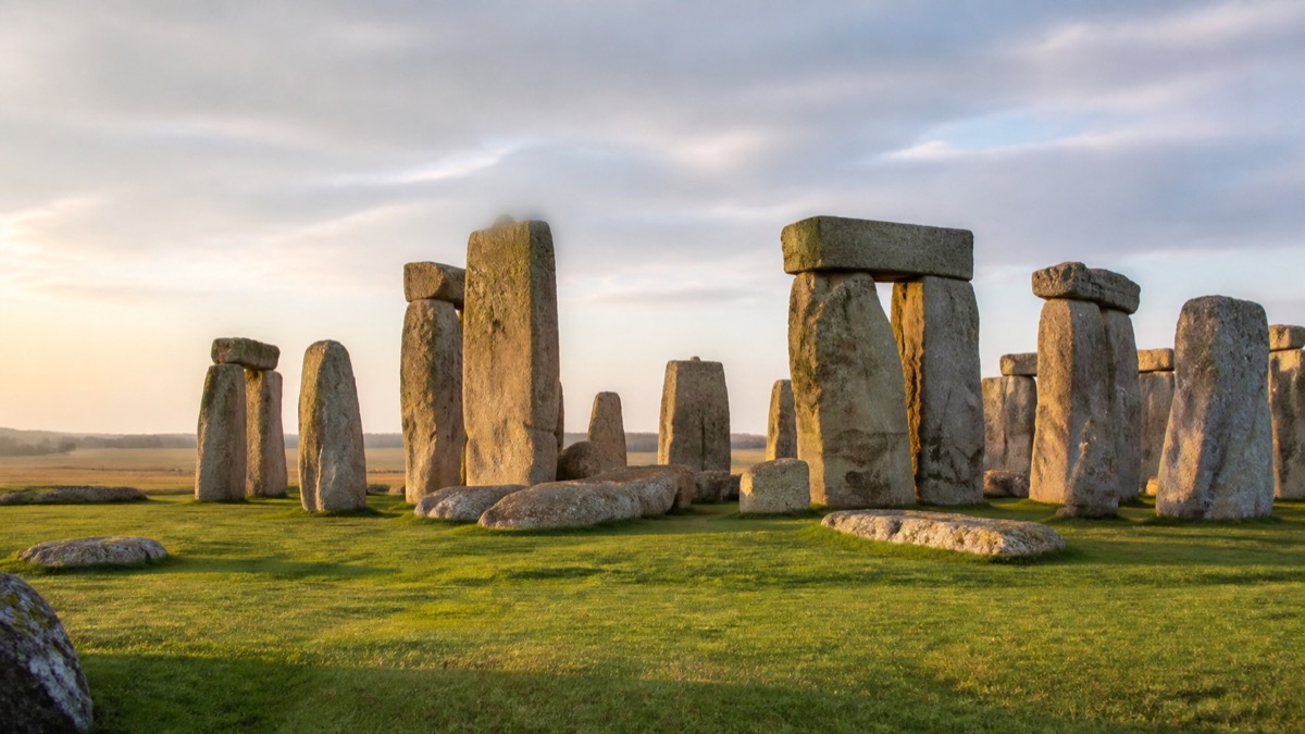 Stonehenge standing in warm morning light on Salisbury Plain